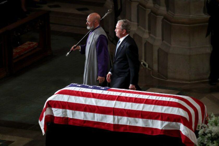 Former President George W. Bush leaves the podium after speaking during the funeral service for Sen. John McCain. | Getty Images