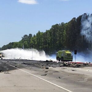 Emergency personnel work at the scene of a military cargo plane crash. | Chris Hanks/Savannah Professional Firefighters Association via AP