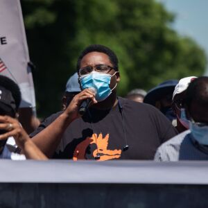 Ald. Jason Irving, 28th Ward, joins community activists and residents on June 12, 2020. They marched on the West Side calling for police reform, better schools, improved hosing, affordable health care and more economic development.