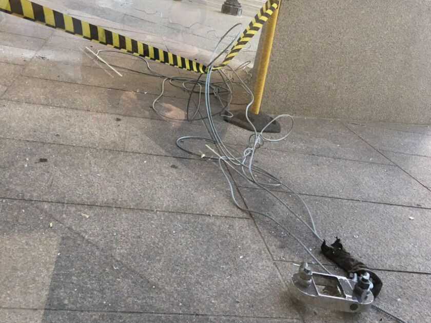 Metal and cable equipments litter the sidewalk outside 150 N. Michigan Ave. after a scaffolding collapse Tuesday afternoon. | Photo provided by Greg Phelps