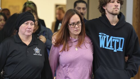 Relatives of slain officer John Bartholomew leave the Leighton Criminal Courthouse on Thursday.