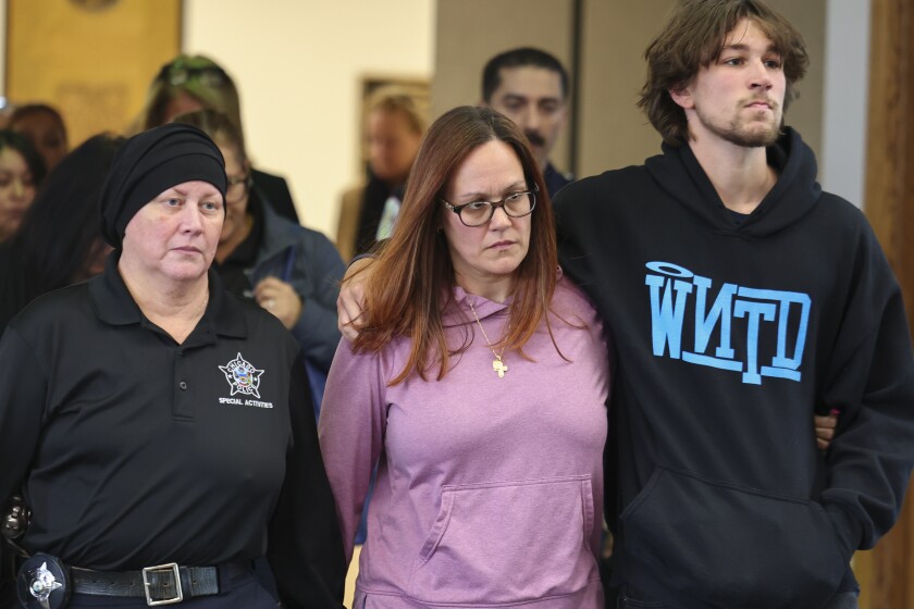 Relatives of slain officer John Bartholomew leave the Leighton Criminal Courthouse on Thursday.