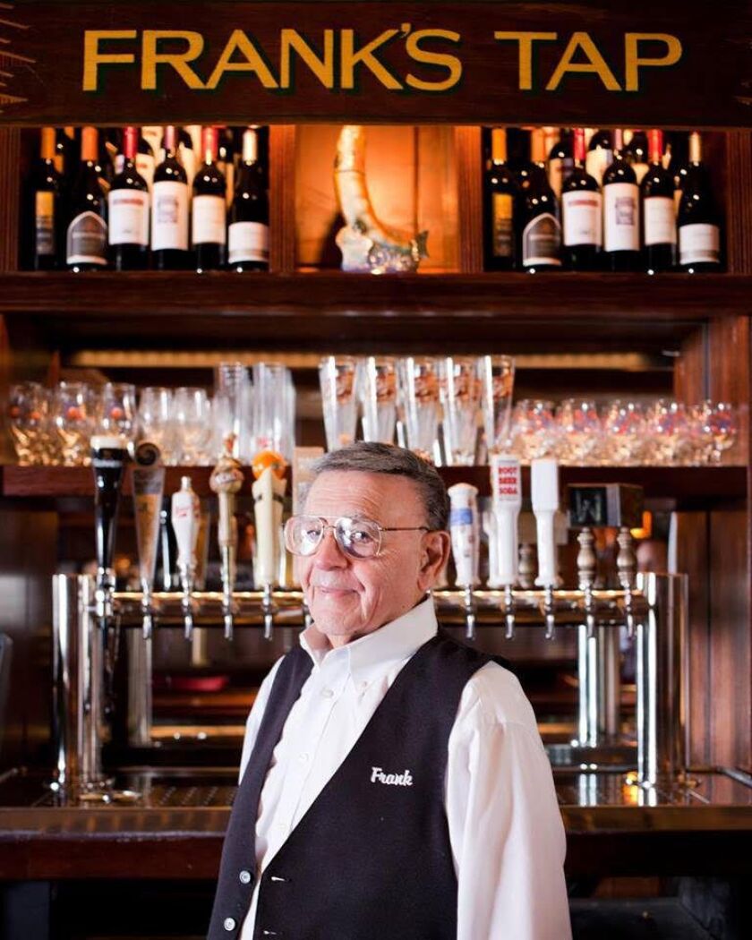 Bartender Frank Rotondo under the “Frank’s Tap” sign at L. Woods Tap and Pine Lodge in Lincolnwood. | Lettuce Entertain You
