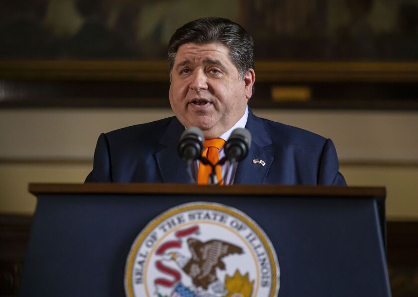 Gov. J.B. Pritzker praises the state budget at a news conference at the State Capitol in Springfield last month.