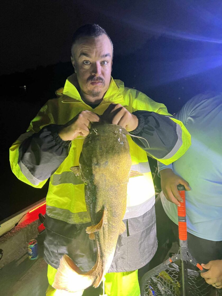 Jeffrey Williams with his first flathead catfish, caught from the Fox River. Provided photo