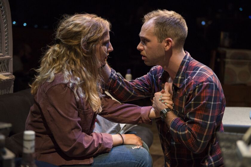 Tina Naponelli and Neil Stratman in the musical “Tomorrow Morning,” presented by Kokandy Productions at Theater Wit. (Photo: Michael Brosilow)