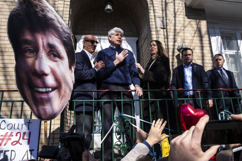 Former Illinois Gov. Rod Blagojevich greets supporters after a news conference outside the family’s Ravenswood Manor home Wednesday.