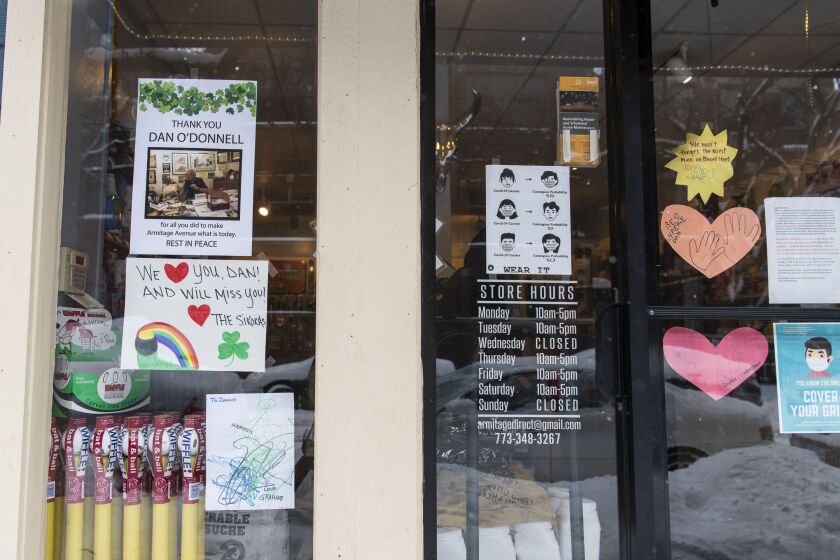 Signs commemorating the late Dan O’Donnell hang on the windows of Armitage Hardware store, 925 W. Armitage Ave.