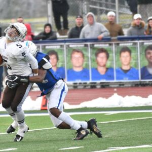 St. Charles North’s Tyler Nubin (27) makes a tackle on Matt Lenti (5). Saturday 11-17-18 Worsom Robinson/For the Sun-Times.