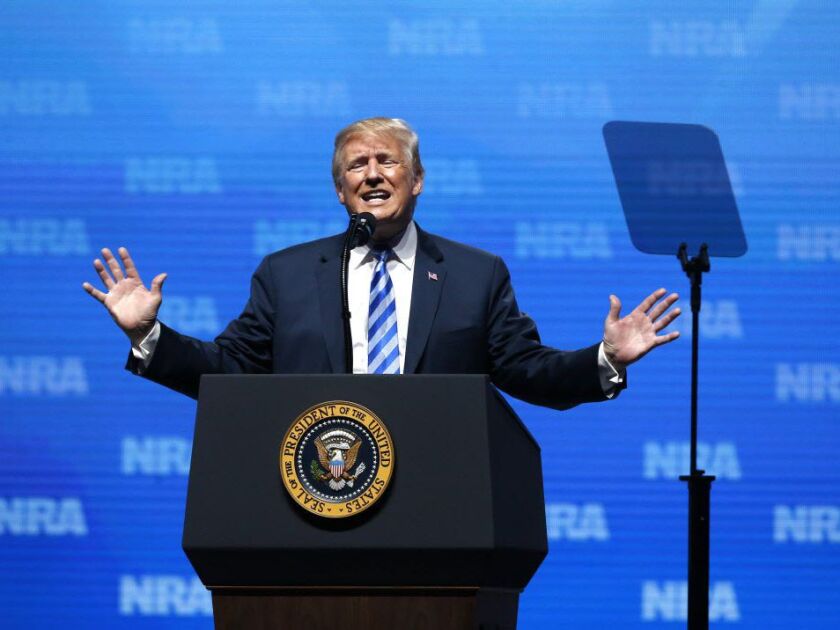 President Donald Trump gestures as he speaks at the National Rifle Association annual convention in Dallas, Friday, May 4, 2018. (AP Photo/Sue Ogrocki)