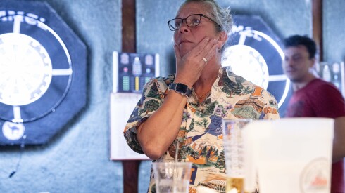 Deb Shawver watches the game between the University of Illinois and the University of Connecticut’s basketball teams at Mullen’s Sports Bar and Grill.