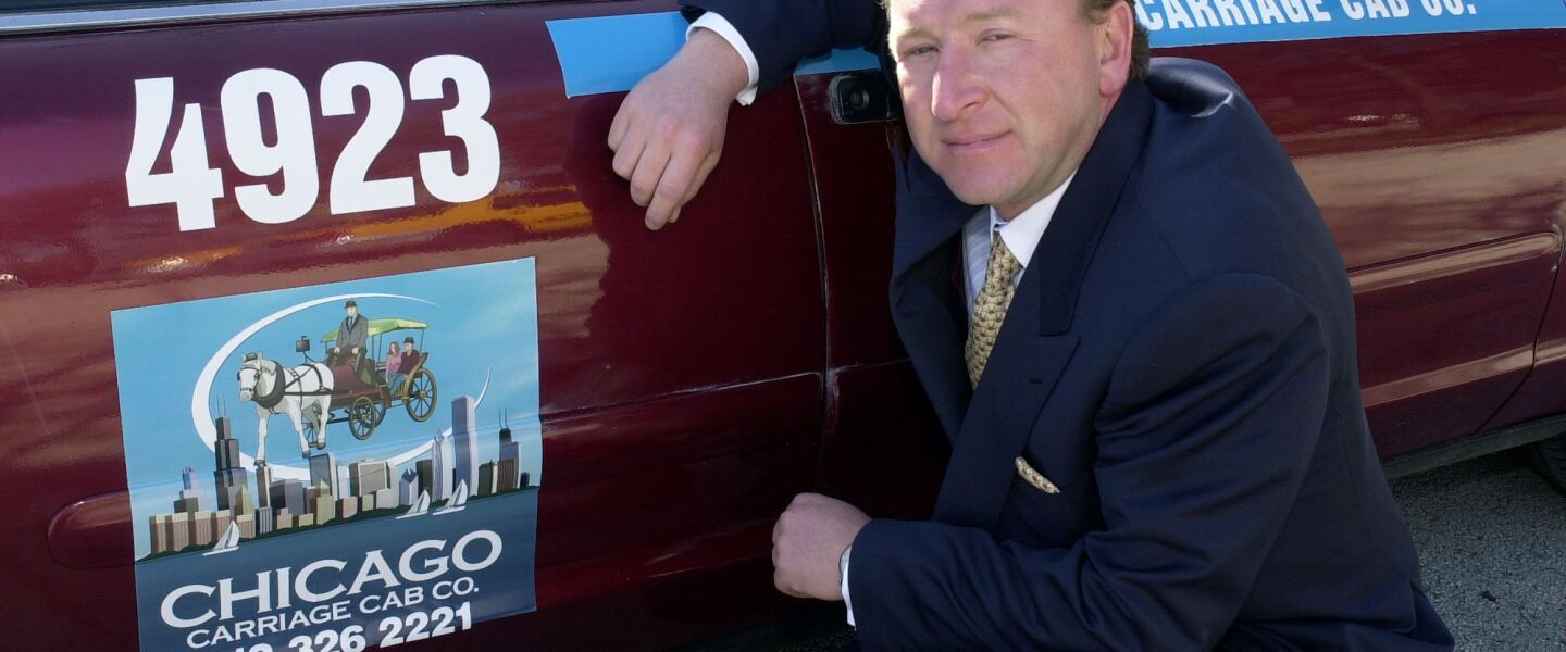 Chicago’s former taxicab king Symon Garber in 2003 with one of his fleet of cabs.