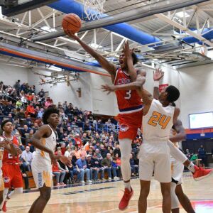 Simeon’s Jaylen Granger (24) hits Curie’s DaJuan Gordon (3) in the face going to the basket, Saturday 12-29-18. Worsom Robinson/For Sun-Times