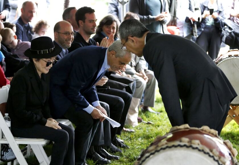 <small><strong>Toshiyuki Iwado (right), Japanese consul general in Chicago, bows to Yoko Ono and Mayor Rahm Emanuel after speaking at Friday’s ceremony to announce the future installation of Ono’s first permanent public art installation in the U.S. | AP P