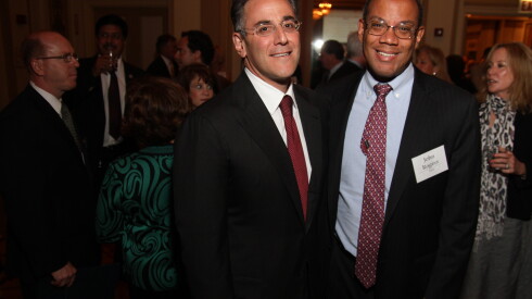 Michael Sacks, left, with John Rogers, at an event in a Chicago ballroom.
