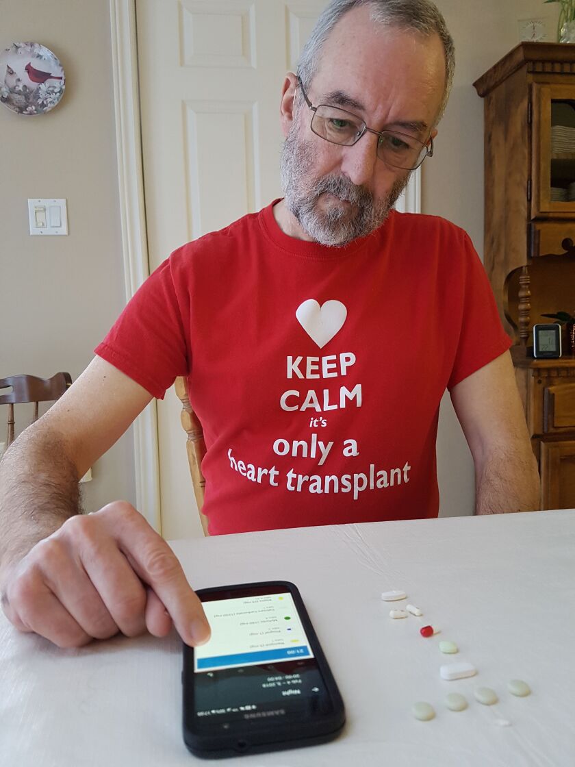 Mike Willis takes 27 pills a day, most of them anti-rejection drugs to ensure that his body doesn’t reject the heart transplant he received 2½ years ago. He uses an app called Medisafe to help him keep track of when it’s time for his next dose.| Courtesy