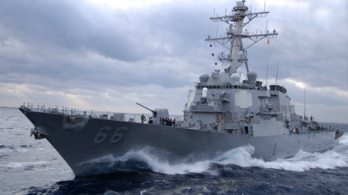 A U.S. Navy destroyer ship, with the number 66, out at sea
