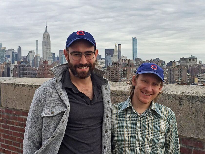 Cubs fan Emmett Adler (left) and co-worker Michael Kosciesza. | Provided photo