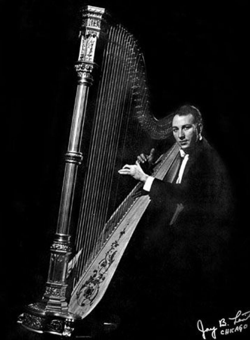 Victor Salvi playing the harp during the earlry days of his career.