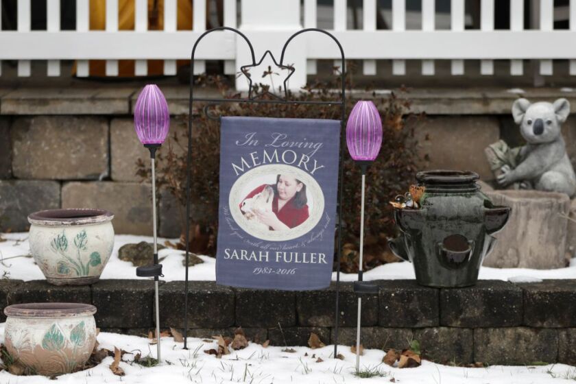 In a photo taken Friday, Jan. 18, 2019, a small memorial in honor of Sarah Fuller, who passed of a prescription drug overdose, is displayed in the yard of her mother Deborah Fuller’s home in West Berlin, N.J. The trial of the Insys Therapeutics Inc. found