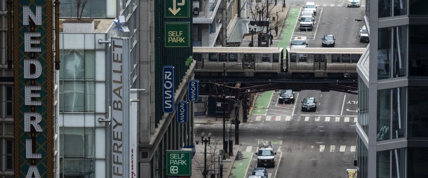 Amid fears of the coronavirus pandemic and a stay-at-home order from Gov. J.B. Pritzker, few pedestrians and minimal traffic could be seen in the Loop, looking east on West Randolph Street from the roof of City Hall during the Wednesday morning commute, April 1, 2020.