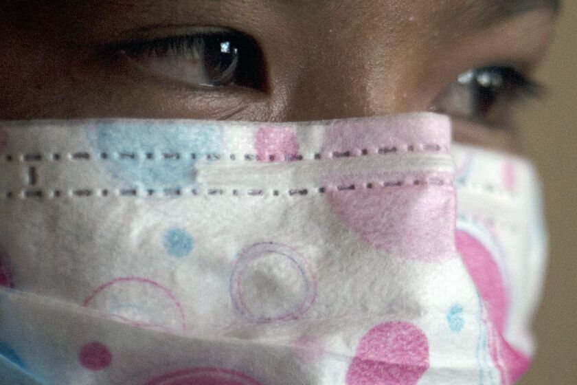Ima, a girl who works informally to help her parents in a palm oil plantation, photographed in Sumatra, Indonesia, Sunday, Sept. 9, 2018.