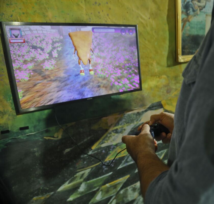 This Nov. 2, 2018 photo shows a pizza video game creation from Jeremey Couillard, a New Media professor at LaGuardia Community College, which is part of an immersive group art exhibition celebrating pizza at The Museum of Pizza in New York. | Bebeto Matth