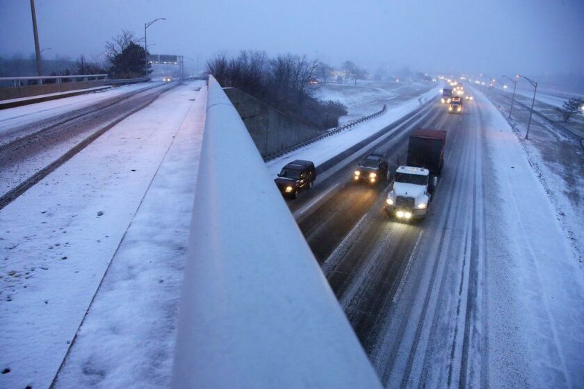 Commuters travel on the southbound side of the New Jersey Turnpike during a snowstorm Thursday, in Woodbridge, N.J. The New Jersey Shore, which has been experiencing deep cold weather to start the new year, is under a winter storm advisory. | Julio Cortez