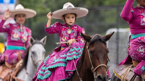A kid rides a horse during the 20th annual Mexican Independence Day Parade along West 18th Street in the Pilsen neighborhood, Saturday afternoon, Sept. 10, 2022.