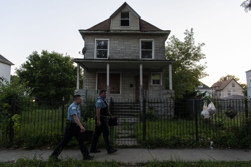 Chicago police officers in the 100 block of North Latrobe Avenue in Austin, where 7-year-old Natalia Wallace was shot to death Saturday night.