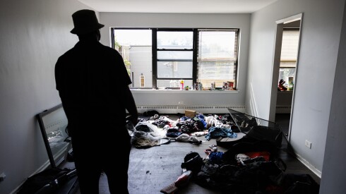 Dan Jones stands in his living room where his personal items can be seen scattered and mixed with strangers personal belongings in the building where ICE raided and detained migrants during a night operation at at 7500 S South Shore Drive in South Shore, Wednesday, Oct. 1, 2025. | Anthony Vazquez/Sun-Times