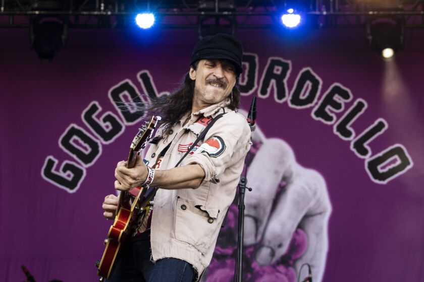 Eugene Hütz, of Gogol Bordello, performs on Day 3 of Riot Fest.