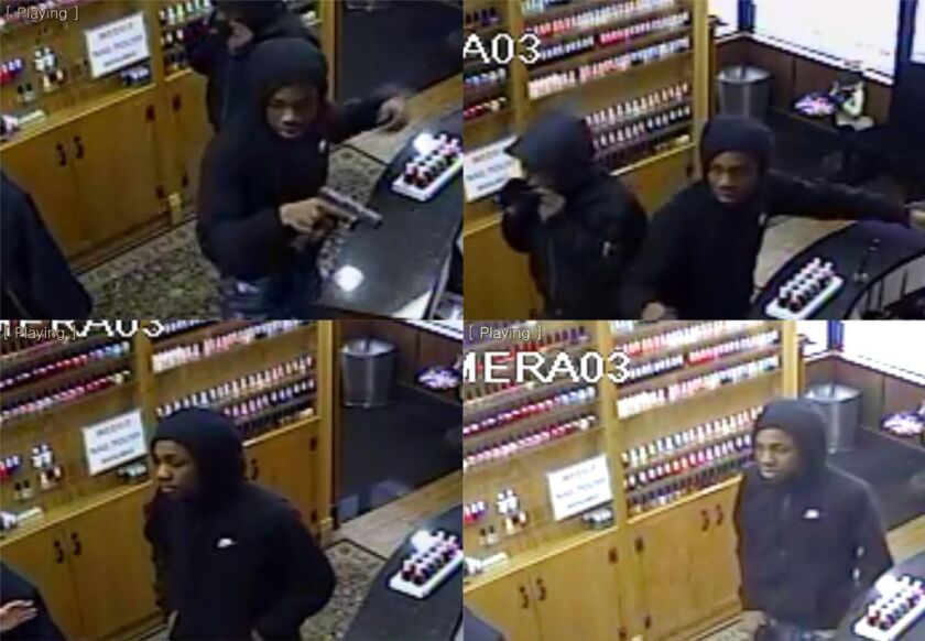 Surveillance photos of two armed suspects who robbed a nail salon on Dec. 1 in the 2100 block of West Roscoe. | Chicago Police