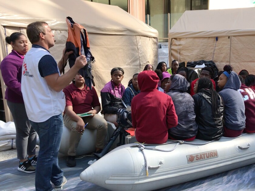 Students from the Sherman School of Excellence learn about crossing the Mediterranean Sea as refugees at the Forced From Home exhibit from Doctors Without Borders. | Emily McTavish/Sun-Times
