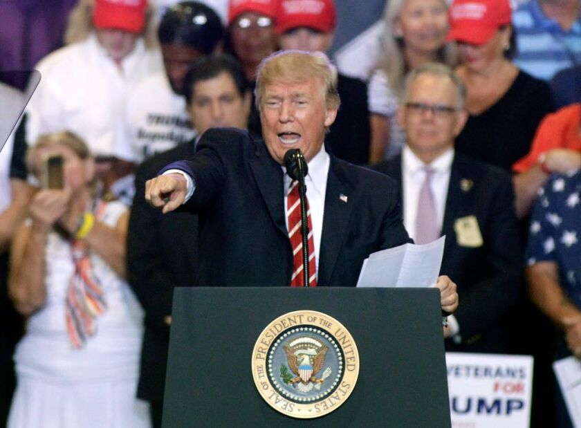 President Donald Trump speaks to supporters at the Phoenix Convention Center during a rally on August 22, 2017 in Phoenix, Arizona. An earlier statement by the president that he was considering a pardon for Joe Arpaio, the former sheriff of Maricopa Count