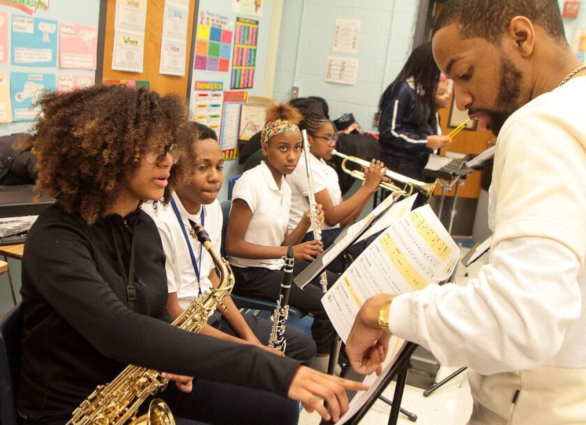 Marilyn Carroll and T.L. Williams go over music during a band rehearsal at Ronald. H. Brown Academy. | Leslie Adkins/For the Sun-Times
