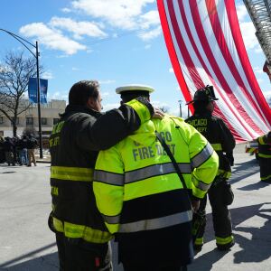 Chicago Fire Department personnel prepare for firefighter Michael Altman's procession to the Cook County medical examiner’s office on Tuesday.