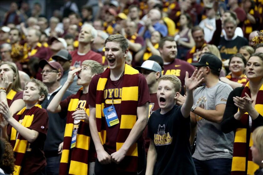 Those maroon-and-yellow Loyola scarves are oh so similar to those sported by Harry Potter and his classmates. | Ronald Martinez/Getty Images