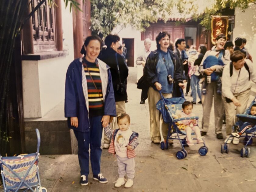 Christine Casper and her newly adopted daughter Claire, then 2, during a trip by Chicago area families to Wuhan, China, in 1999.