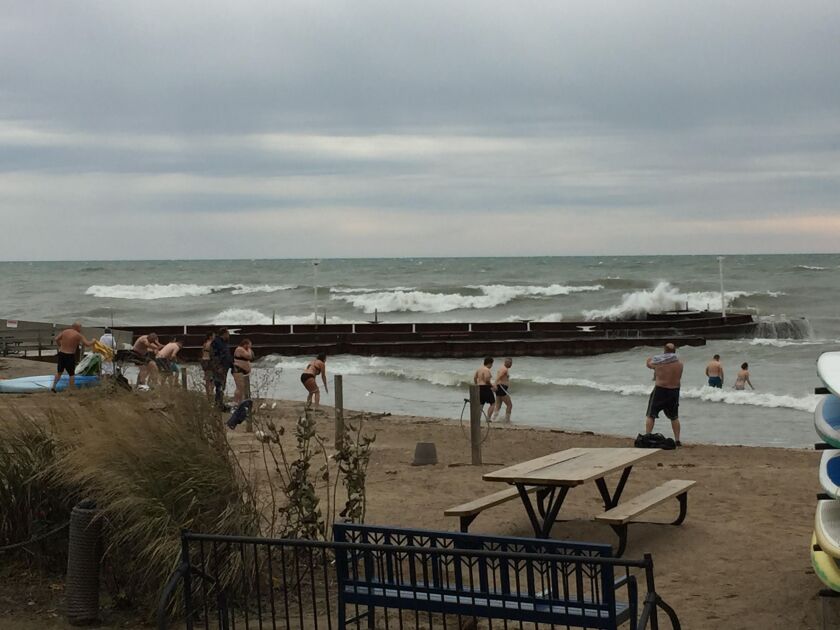 A group of “cold-weather” swimmers enters the water near Highland Park Sunday. | Provided/Richard Hammond