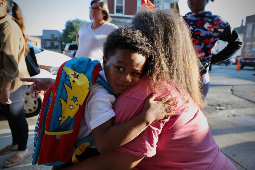 Freddie Taylor, a Pickard Elementary student in kindergarten, hugs his mom Rockia Taylor before he starts his first day of Chicago Public Schools on Monday Aug. 22, 2022.