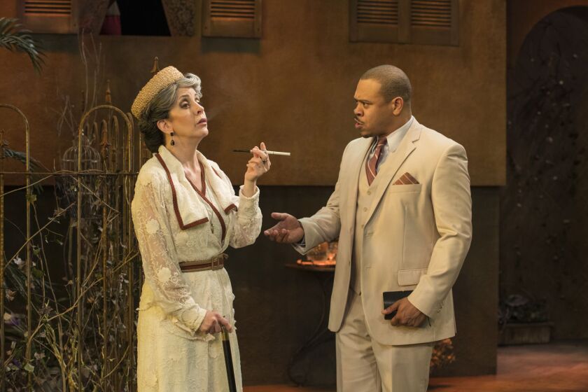 Aunt Violet (Mary K. Nigohosian) is confronted by Dr. Cukrowicz (Wardell Julius Clark) in Raven Theatre’s production of “Suddenly Last Summer.” | Michael Brosilow
