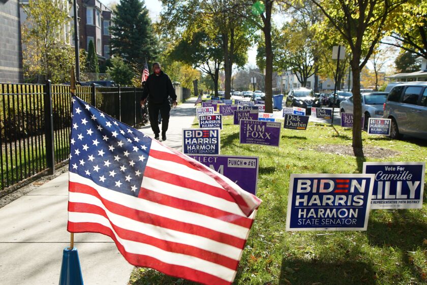 Signs on Election Day sit outside Edward Duke Ellington School at 243 N. Parkside Ave. in Austin on the West Side, Tuesday afternoon, Nov. 3, 2020.