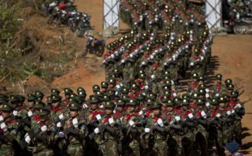 Taiang National Liberation army troops march in Mar Wong Village, northern Shan state during a celebration marking the 52nd anniversary of their insurrection against successive Myanmar governments. (AP Photo/Gemunu Amarasinghe)