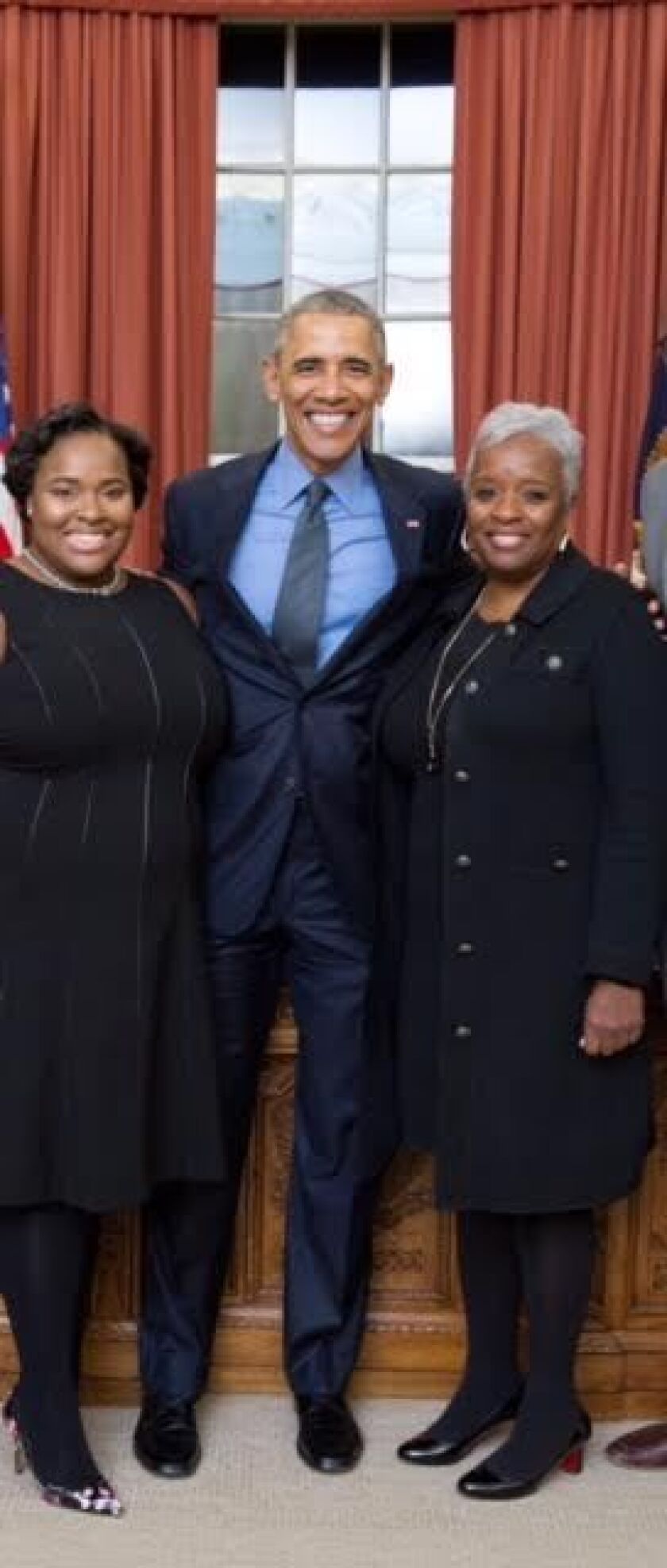 Desiree L. Tate (right) with President Obama and her daughter, Ashley Tate-Gilmore, who was a director of the White House travel office in the Obama administration. | Provided photo
