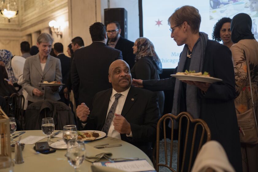 Chicago Police Supt. Eddie Johnson speaks to Amy Rule, Mayor Rahm Emanuel’s wife, during the annual iftar meal at the Chicago Cultural Center on May 7, 2019. | Pat Nabong/For The Sun-Times