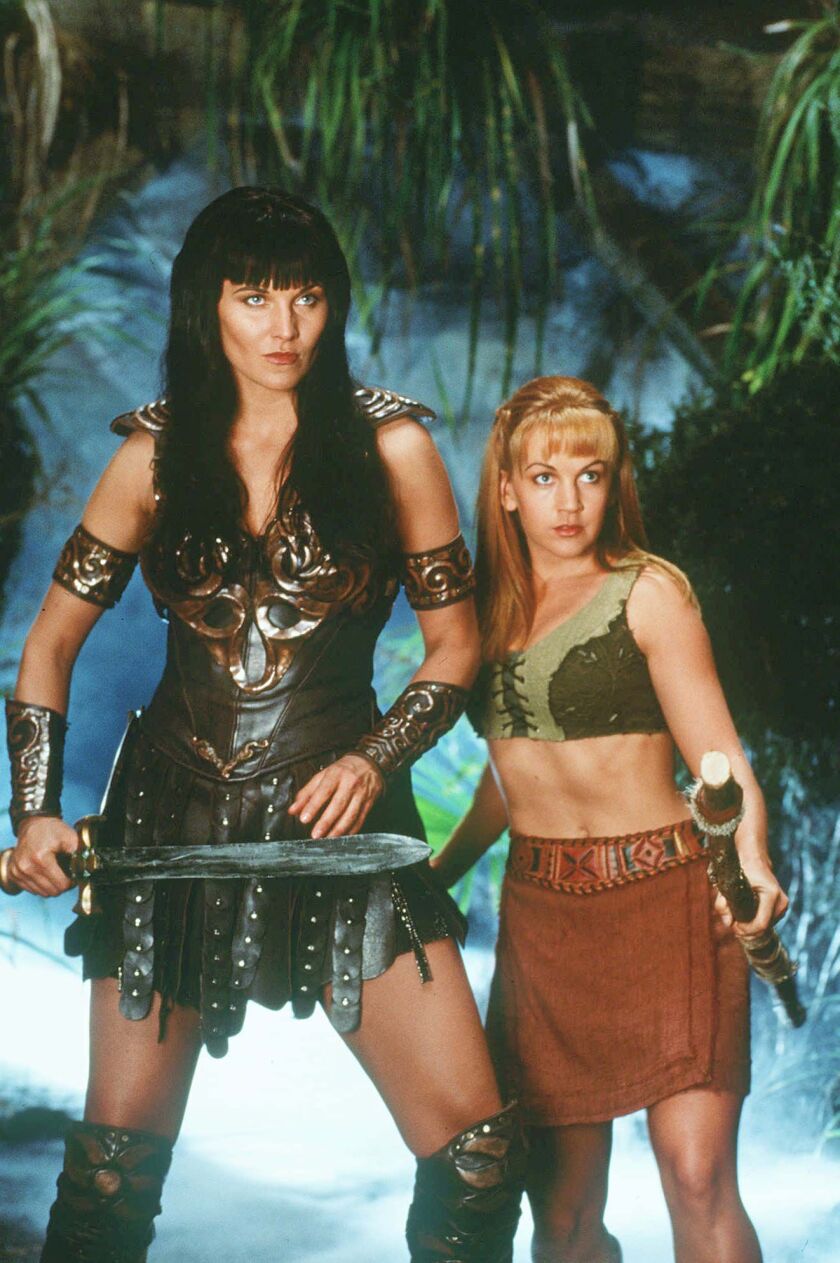 Lucy Lawless as Xena poses with Renee O’Connor, who plays her sidekick Gabrielle in the syndicated television show “Xena: Warrior Princess.’’
