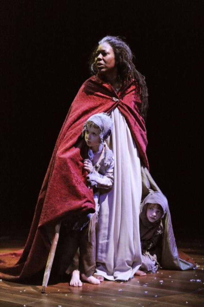 In 2009, Penelope Walker starred as the Ghost of Christmas Present, with John Babbo (Ignorance, left) and Caroline Heffernan (Want) in the Goodman Theatre’s annual production of “A Christmas Carol.” | PHOTO BY LIZ LAUREN