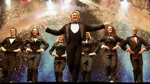 Michael Flatley and his “Lord Of The Dance” company perform at Wembley Arena in 2006, in London, England. Flatley once considered a career as a boxer.