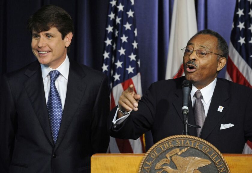 Former Illinois Attorney General Roland Burris takes questions as Gov. Rod Blagojevich listens.
